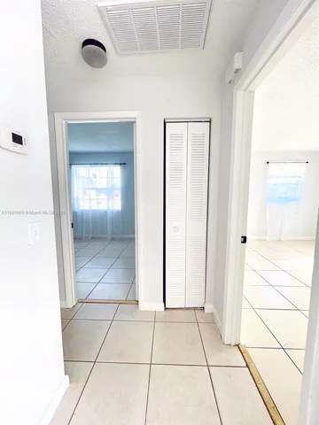 a bathroom with a toilet a sink and a mirror