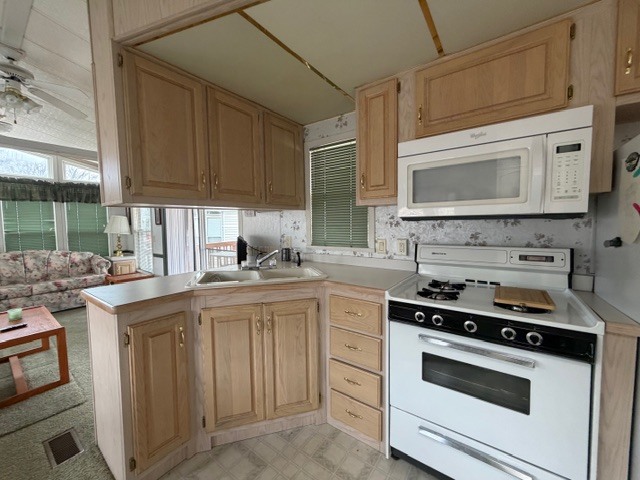 2795 East 28th Road Marseilles, IL 61341 - Photo 11 of 64 a kitchen with stainless steel appliances a stove a sink and a microwave
