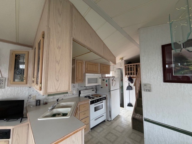 2795 East 28th Road Marseilles, IL 61341 - Photo 13 of 64 a kitchen with a sink stove and refrigerator