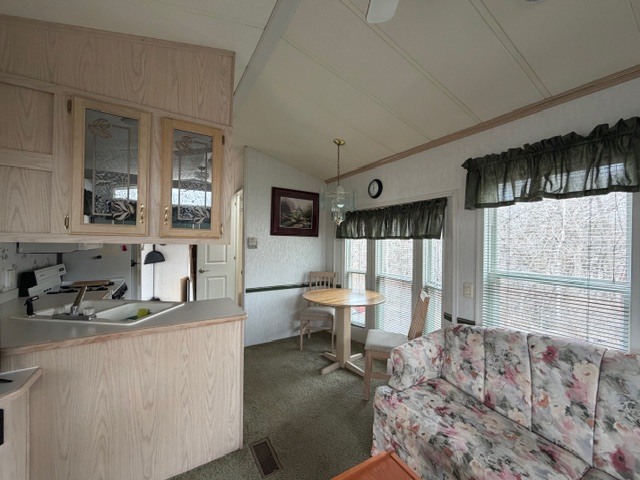 2795 East 28th Road Marseilles, IL 61341 - Photo 9 of 64 a living room with furniture a large window and flat screen tv