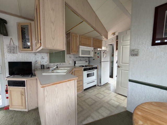 2795 East 28th Road Marseilles, IL 61341 - Photo 10 of 64 a kitchen with stainless steel appliances a refrigerator sink and microwave