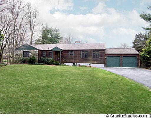 36 Spicer Road Westport, CT 06880 - Photo 1 of 1 a view of a house with a yard and sitting area