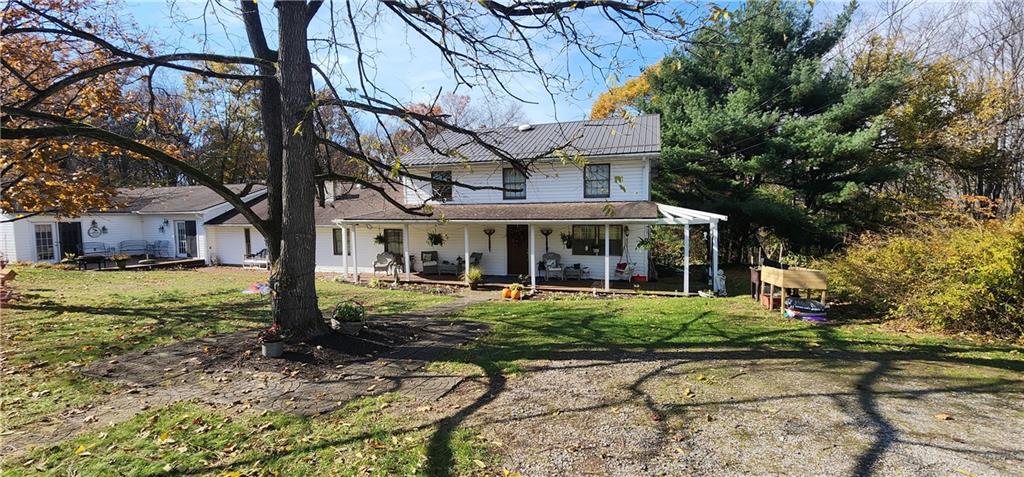 1405 Madison Road Templeton, PA 16259 - Photo 1 of 50 a front view of a house with garden
