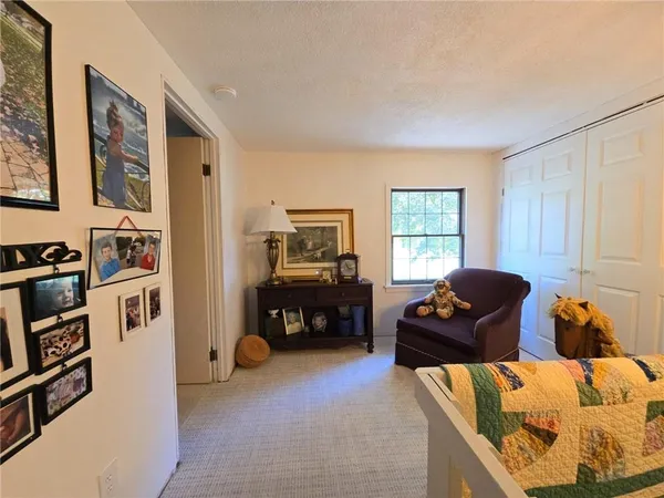 a living room with furniture window and gym equipment