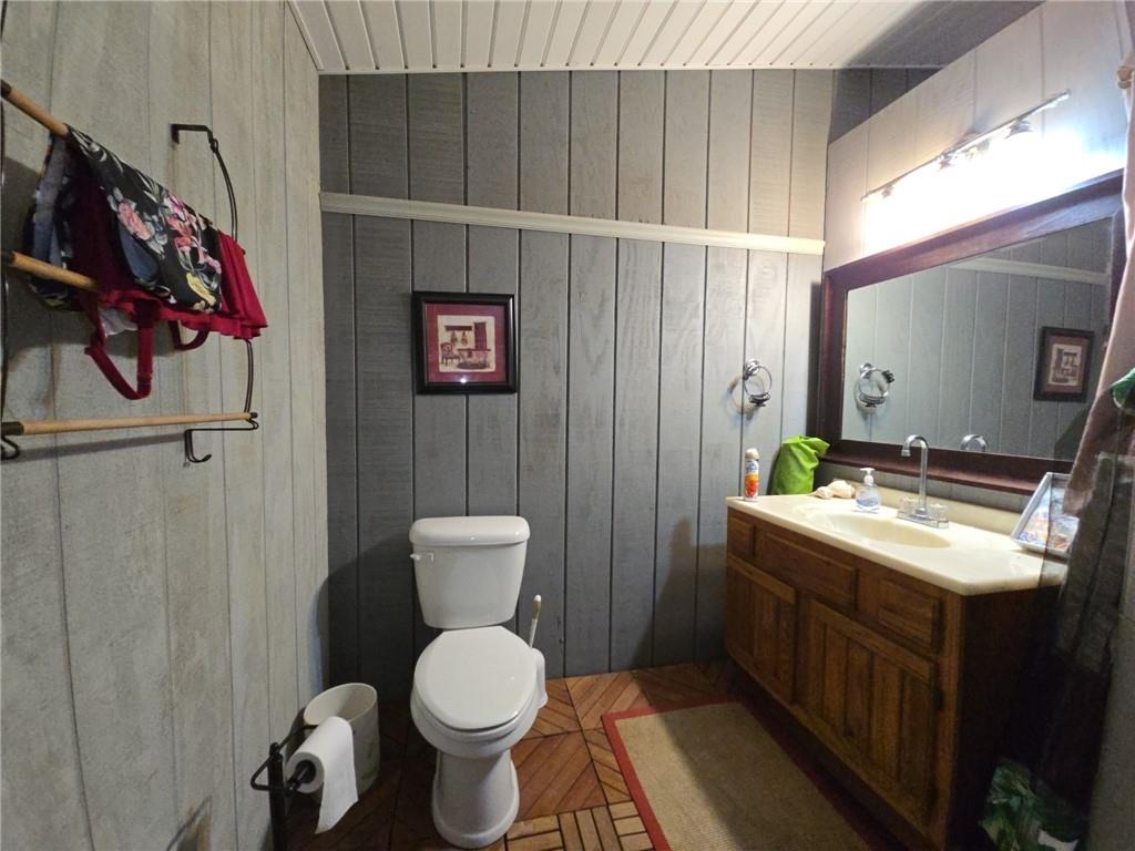 1405 Madison Road Templeton, PA 16259 - Photo 41 of 50 a bathroom with a toilet sink and mirror