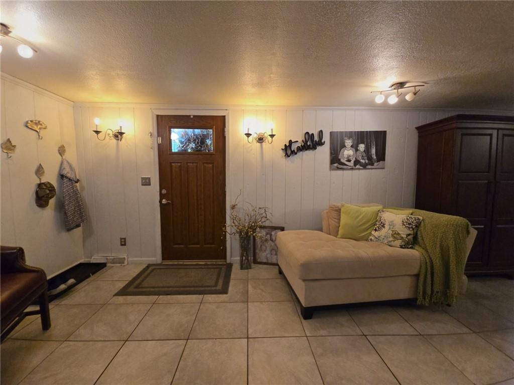 1405 Madison Road Templeton, PA 16259 - Photo 7 of 50 a living room with a couch and a shower