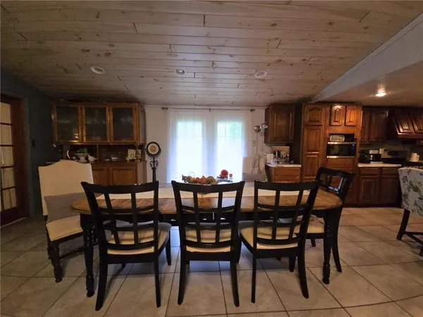 a view of a dining room with furniture and window