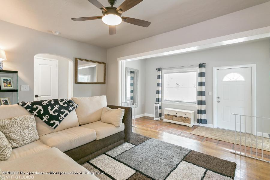 831 Hampton Road West Palm Beach, FL 33405 - Photo 3 of 10 a living room with furniture a ceiling fan and a rug