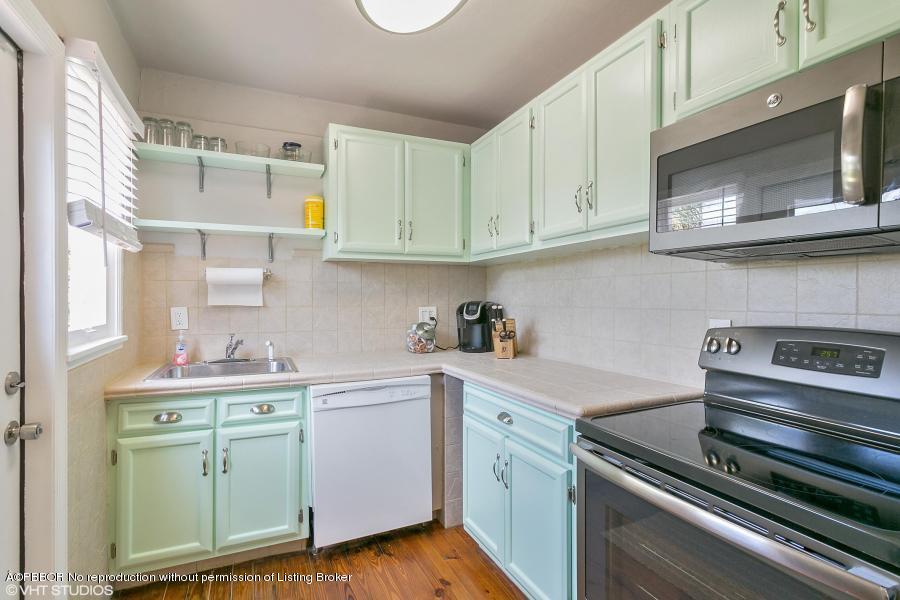 831 Hampton Road West Palm Beach, FL 33405 - Photo 4 of 10 a kitchen with cabinets stainless steel appliances and a sink