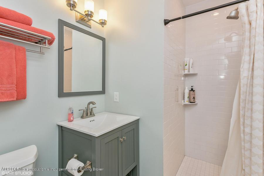 831 Hampton Road West Palm Beach, FL 33405 - Photo 7 of 10 a bathroom with a sink toilet and shower
