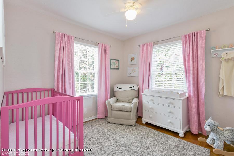 831 Hampton Road West Palm Beach, FL 33405 - Photo 9 of 10 a bedroom with a bed and a window