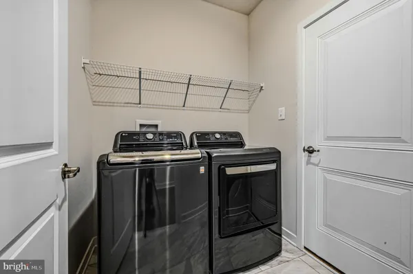 a utility room with washer and dryer