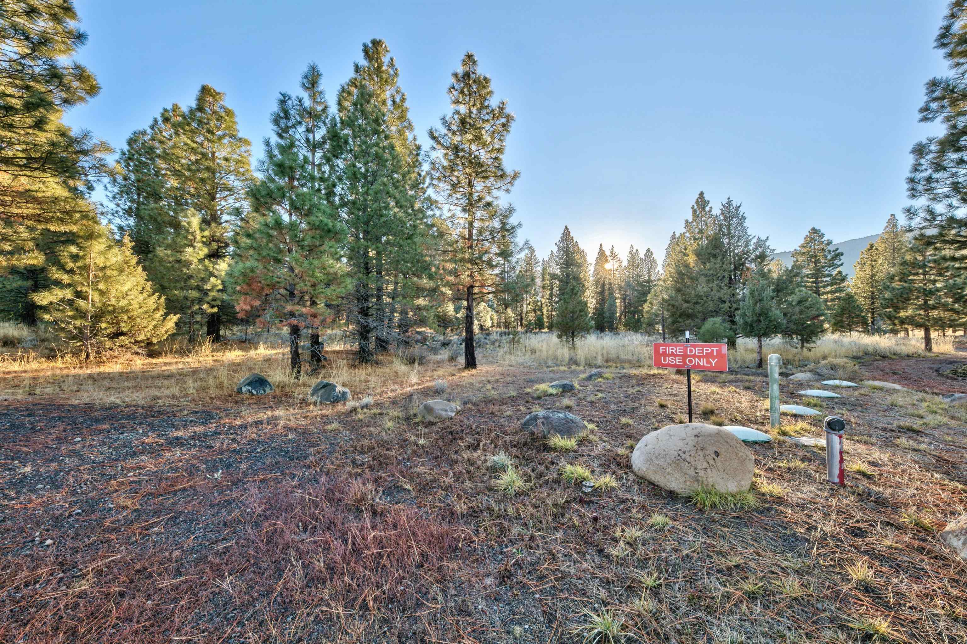 400 Dante Road Sierraville, CA 96126 - Photo 17 of 19 a backyard of a house with fire pit and outdoor seating