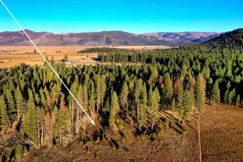 a view of a city with mountains in the background