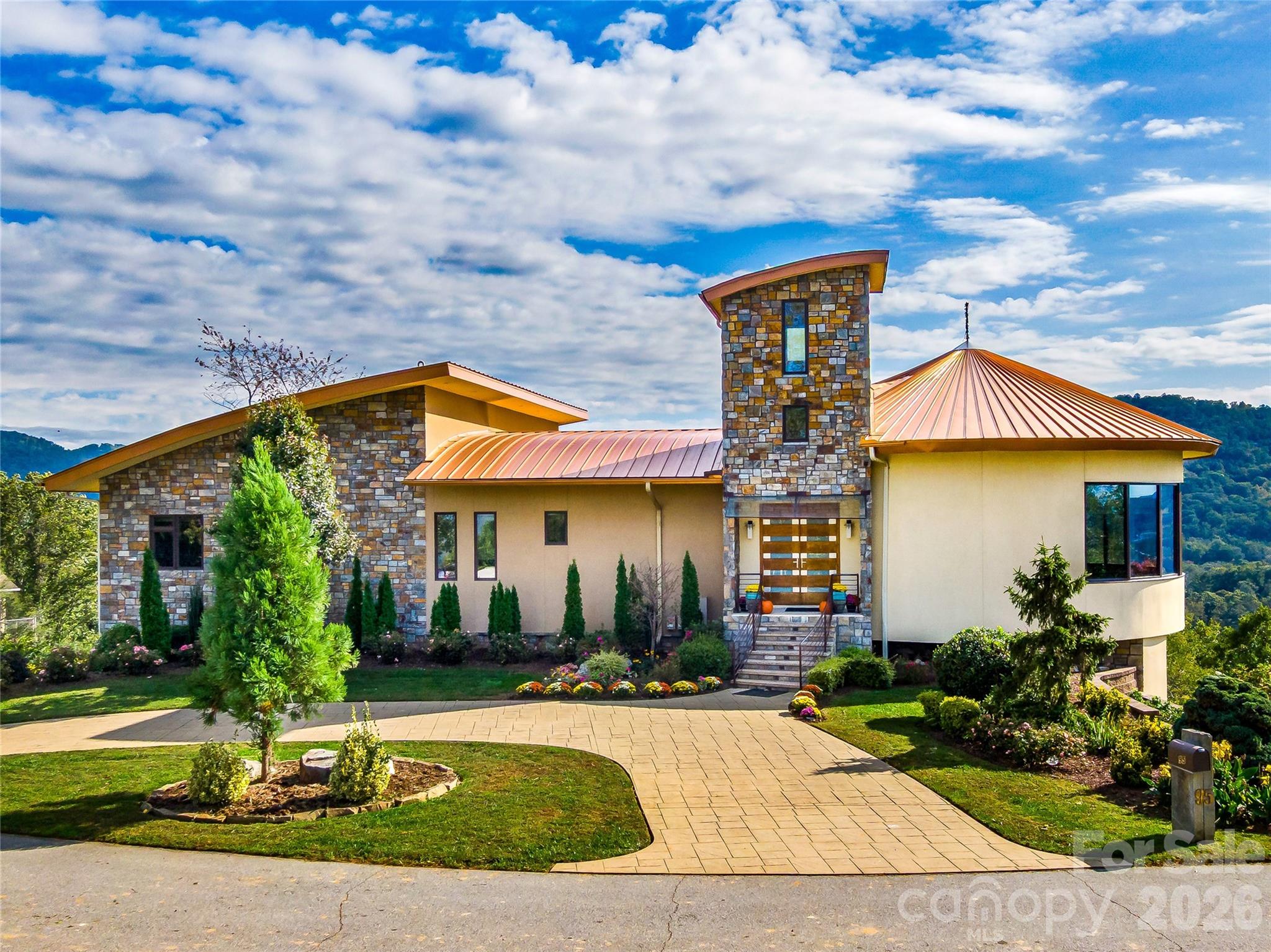 a front view of house with yard and green space