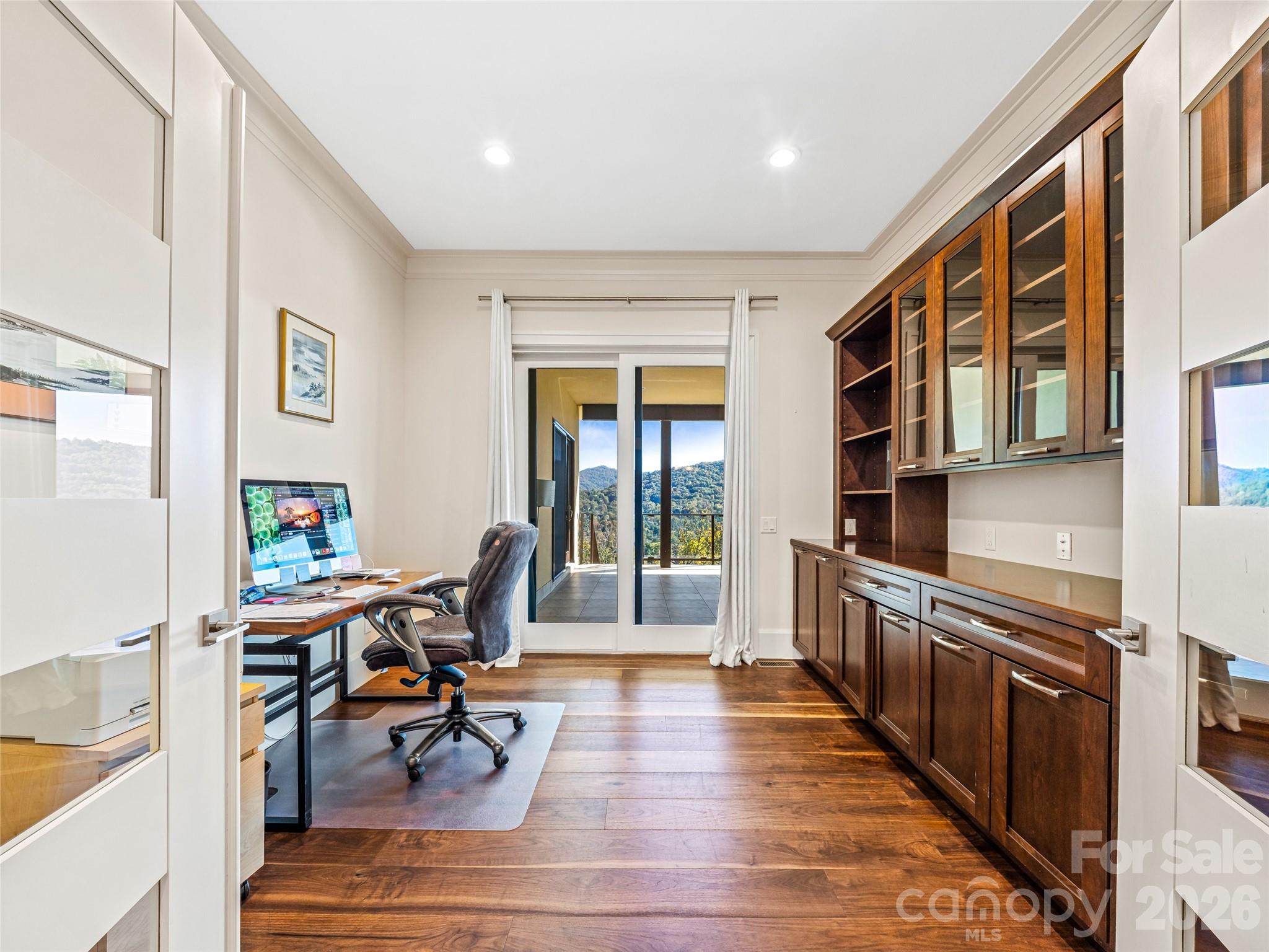 95 Horizon Hill Road Asheville, NC 28804 - Photo 27 of 47 a view of a dining room with furniture a rug and wooden floor