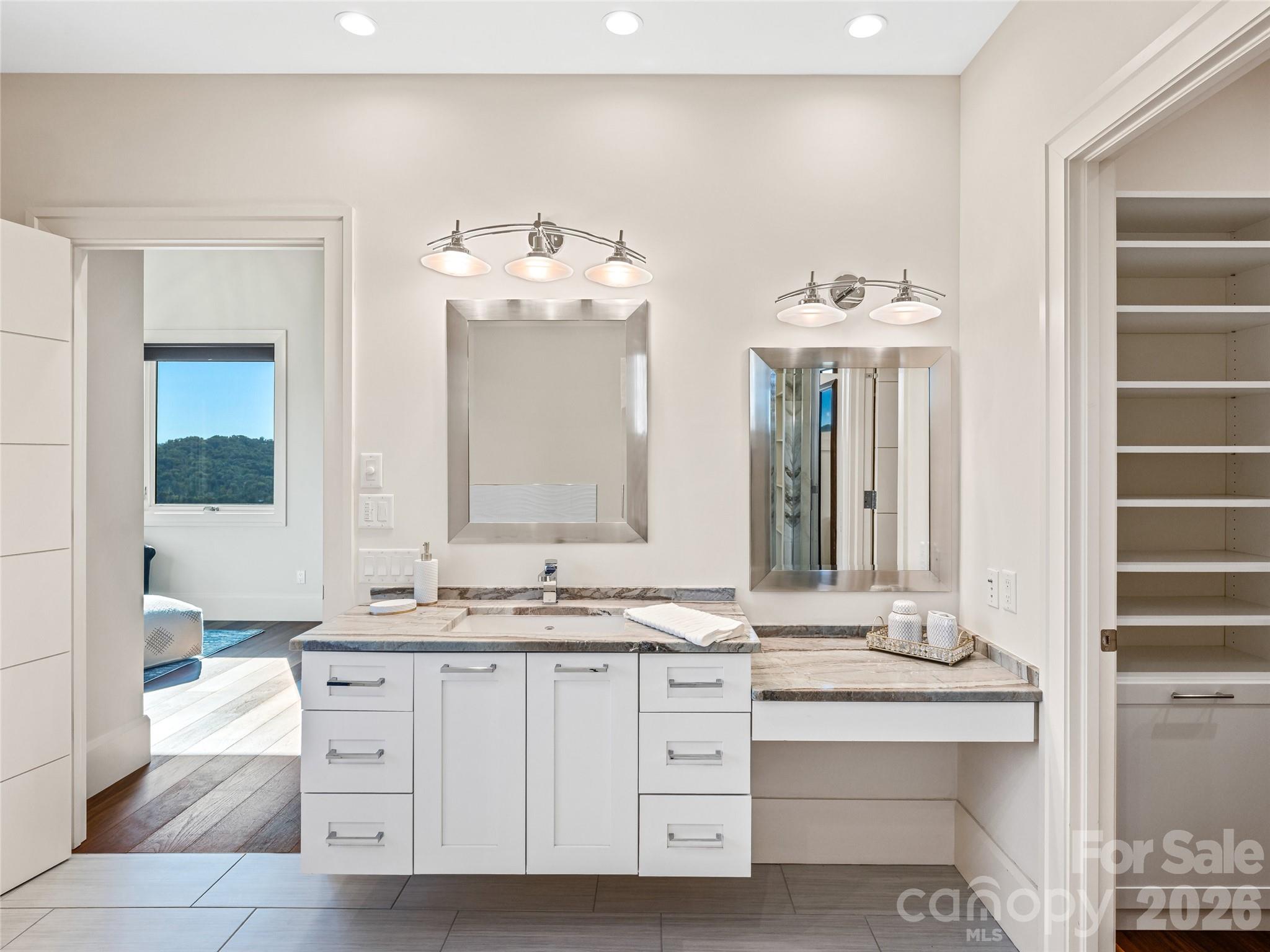 95 Horizon Hill Road Asheville, NC 28804 - Photo 35 of 47 a bathroom with a double vanity sink and a mirror