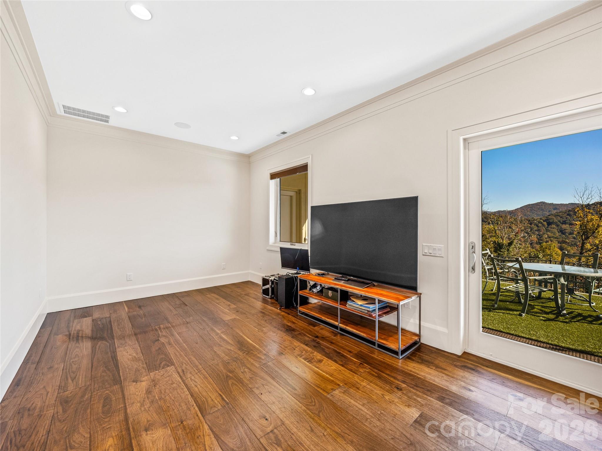 95 Horizon Hill Road Asheville, NC 28804 - Photo 39 of 47 a living room with couch and a flat screen tv