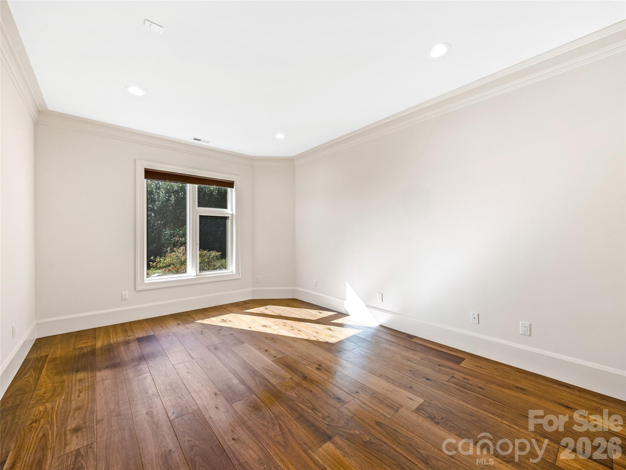 95 Horizon Hill Road Asheville, NC 28804 - Photo 41 of 47 an empty room with wooden floor and windows