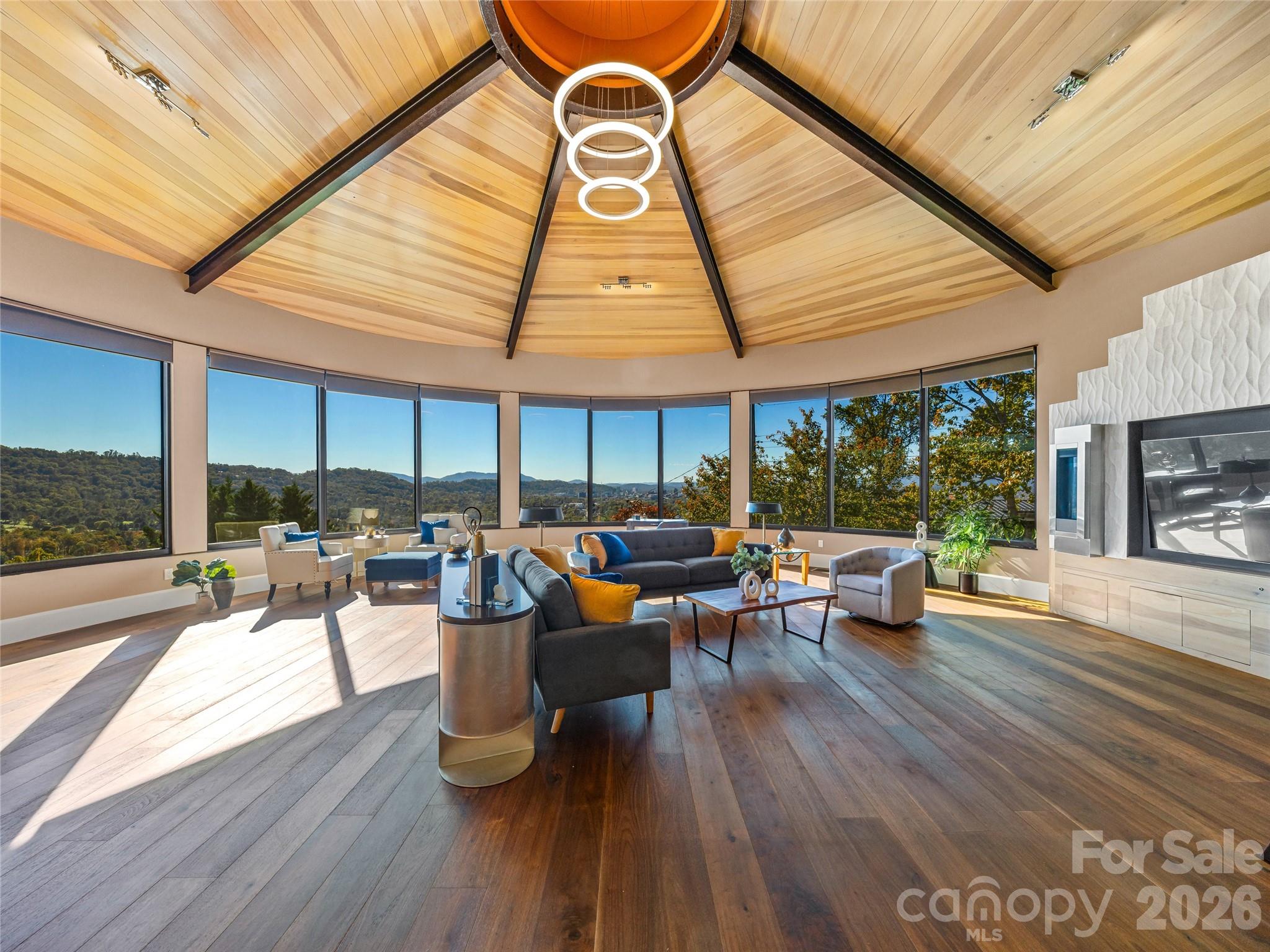 95 Horizon Hill Road Asheville, NC 28804 - Photo 8 of 47 a living room with furniture a wooden floor and a fireplace