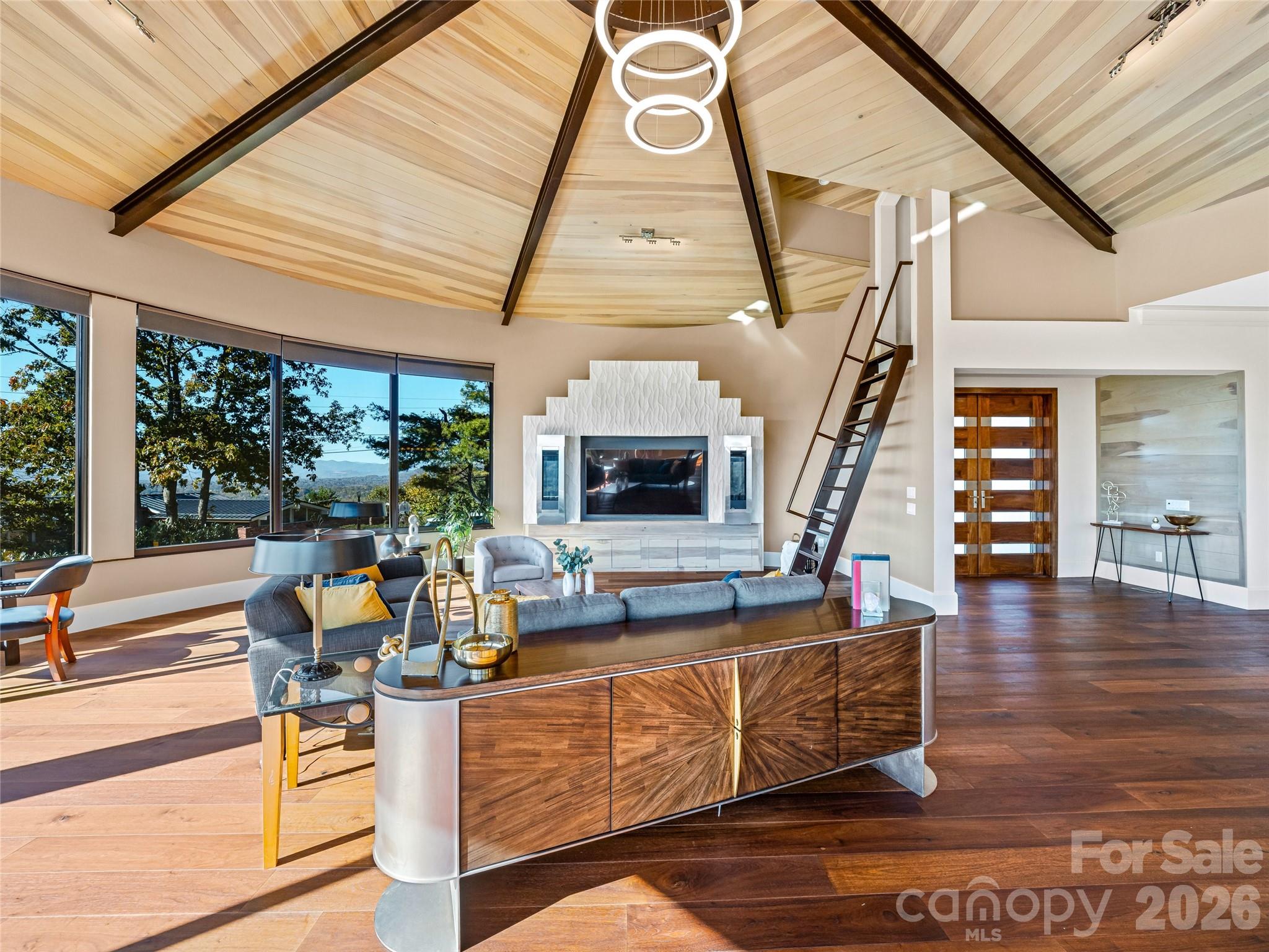 95 Horizon Hill Road Asheville, NC 28804 - Photo 9 of 47 a living room with furniture a fireplace and a floor to ceiling window