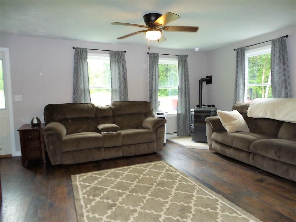 76 Martin Stream Road Fairfield, ME 04937 - Photo 6 of 27 Living room has a pellet stove