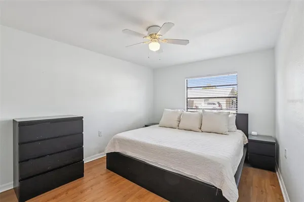 a bedroom with a bed and window