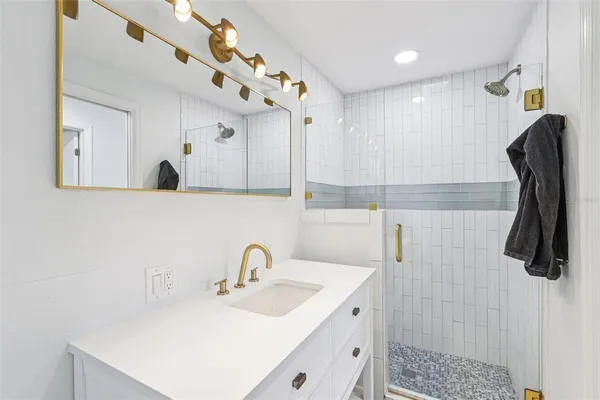 a bathroom with a sink and mirror