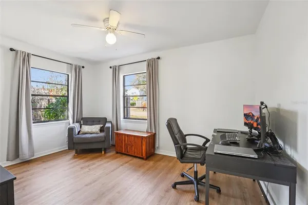 a work room with furniture and windows