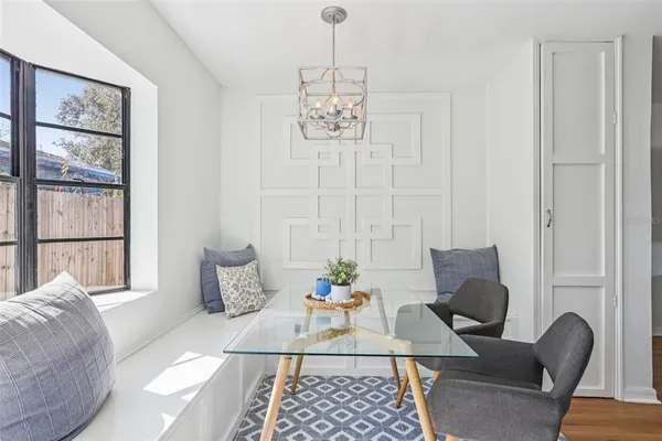 a view of a livingroom with furniture and a window