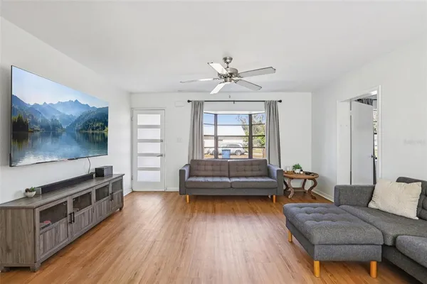 a living room with furniture and a flat screen tv