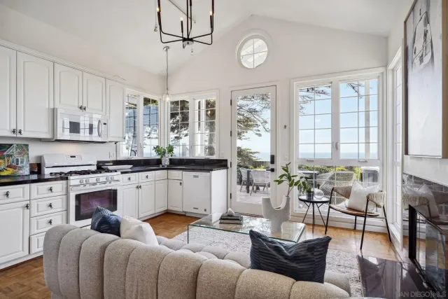 a bathroom with a granite countertop sink a toilet and a mirror