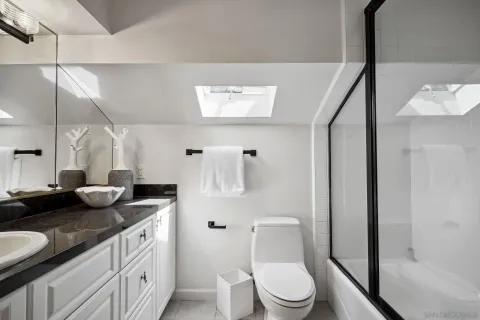 a bedroom with bed and window