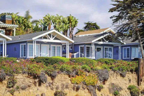 a front view of a house with garden