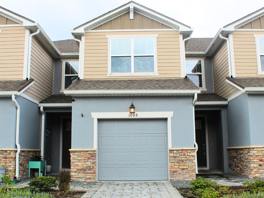 a front view of a house with a garage