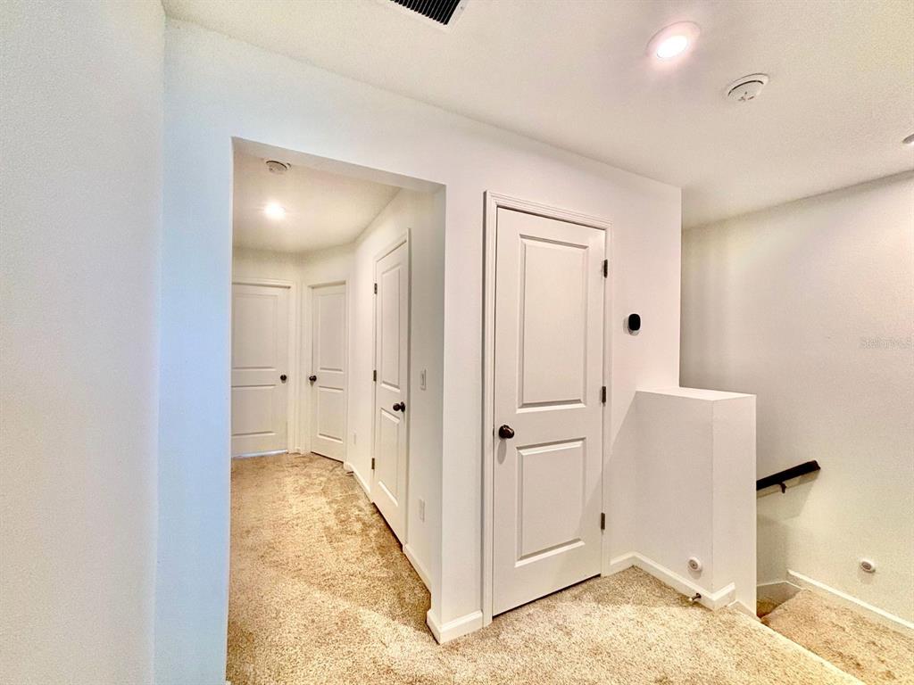 1005 Spring Palms Loop Orlando, FL 32828 - Photo 14 of 29 a view of a room with wooden floor and cabinet