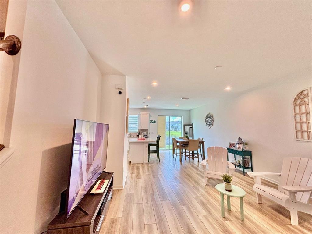 1005 Spring Palms Loop Orlando, FL 32828 - Photo 2 of 29 a living room with furniture and a wooden floor