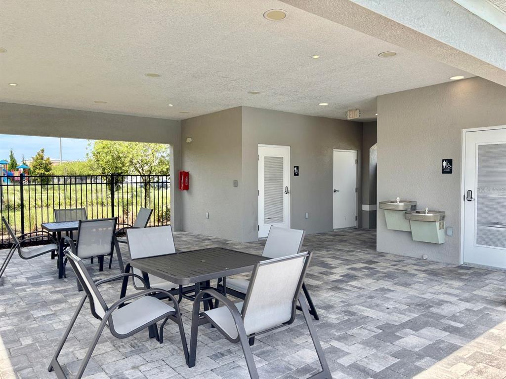 1005 Spring Palms Loop Orlando, FL 32828 - Photo 25 of 29 a view of a dining room with furniture window and outside view