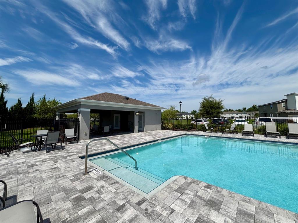1005 Spring Palms Loop Orlando, FL 32828 - Photo 26 of 29 a view of a swimming pool with a patio