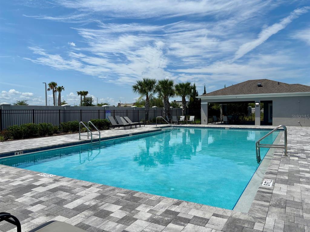 1005 Spring Palms Loop Orlando, FL 32828 - Photo 27 of 29 a view of swimming pool with a yard