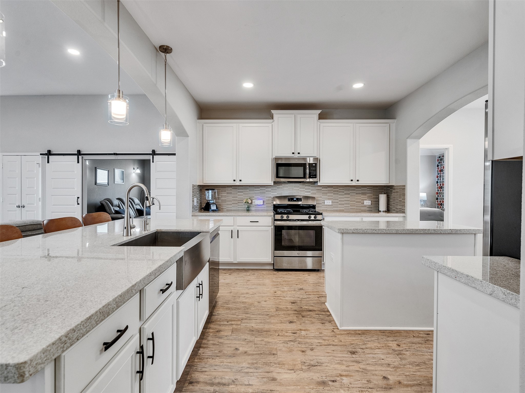 1841 Alyssa Way Alvin, TX 77511 - Photo 19 of 48 a kitchen with kitchen island granite countertop appliances cabinets and a sink