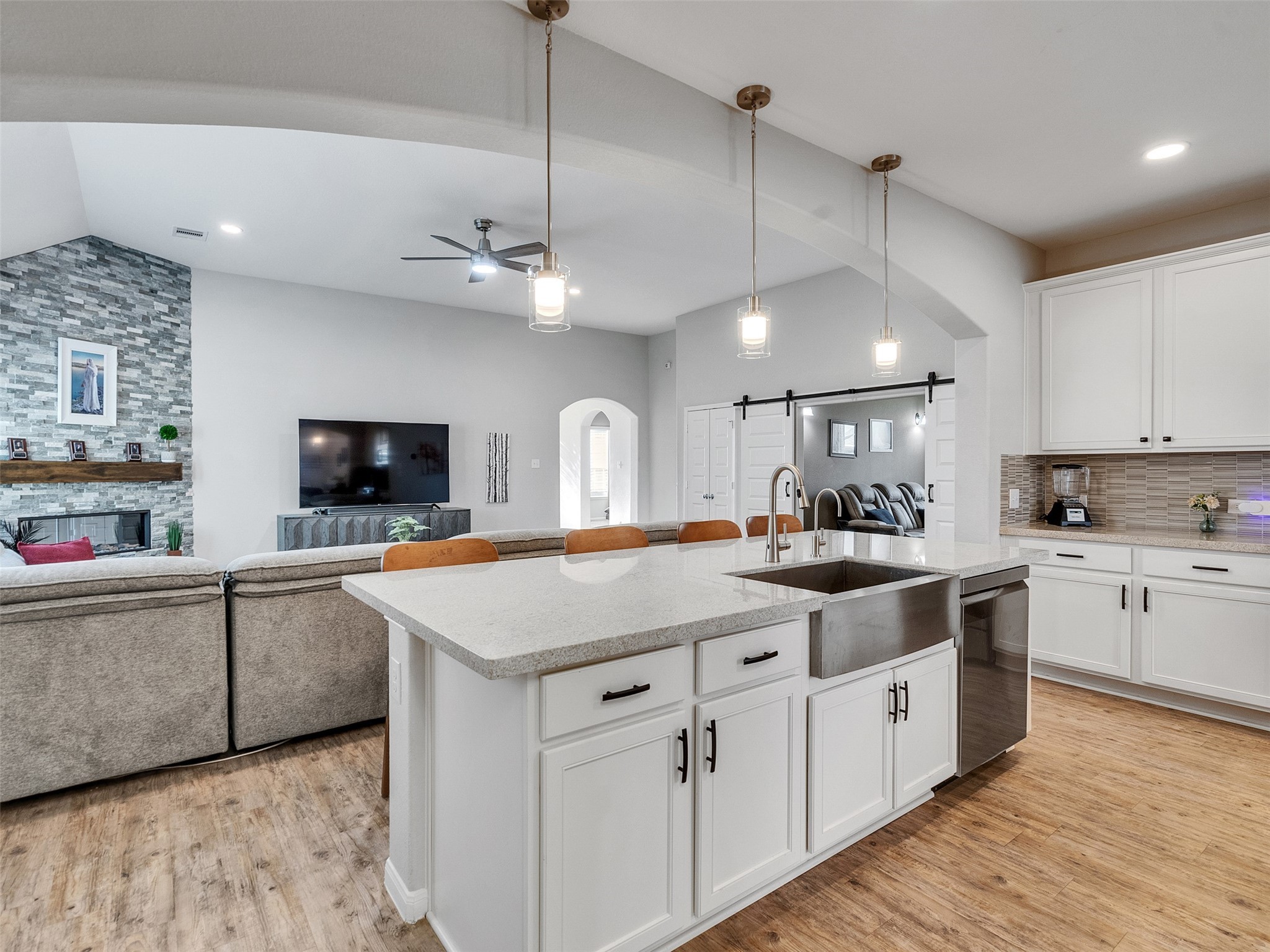 1841 Alyssa Way Alvin, TX 77511 - Photo 22 of 48 a kitchen with stainless steel appliances granite countertop a sink a stove and a wooden floors