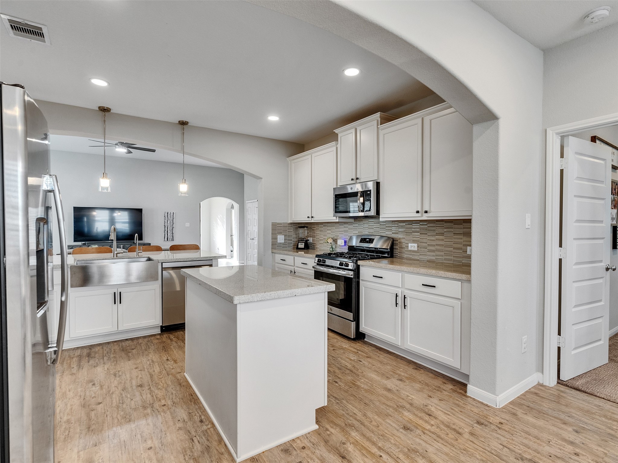 1841 Alyssa Way Alvin, TX 77511 - Photo 25 of 48 a kitchen with white cabinets appliances and sink