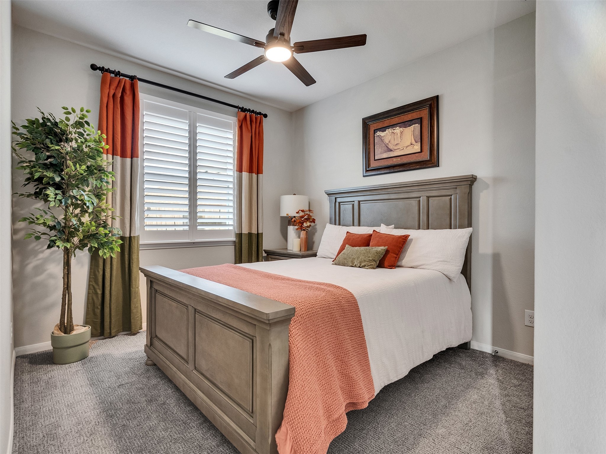 1841 Alyssa Way Alvin, TX 77511 - Photo 28 of 48 a bedroom with bed and a potted plant