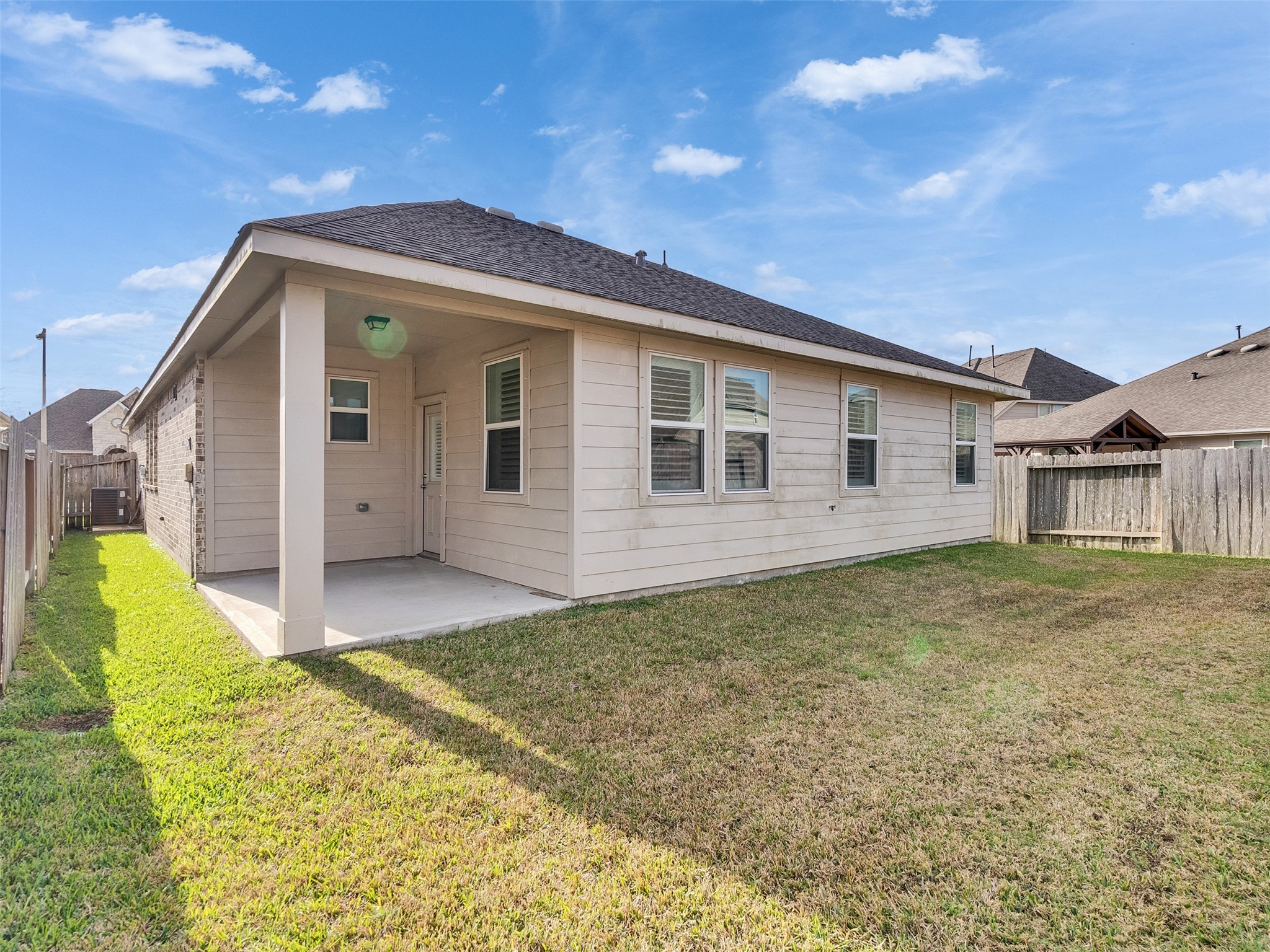 1841 Alyssa Way Alvin, TX 77511 - Photo 47 of 48 a view of a house with a backyard