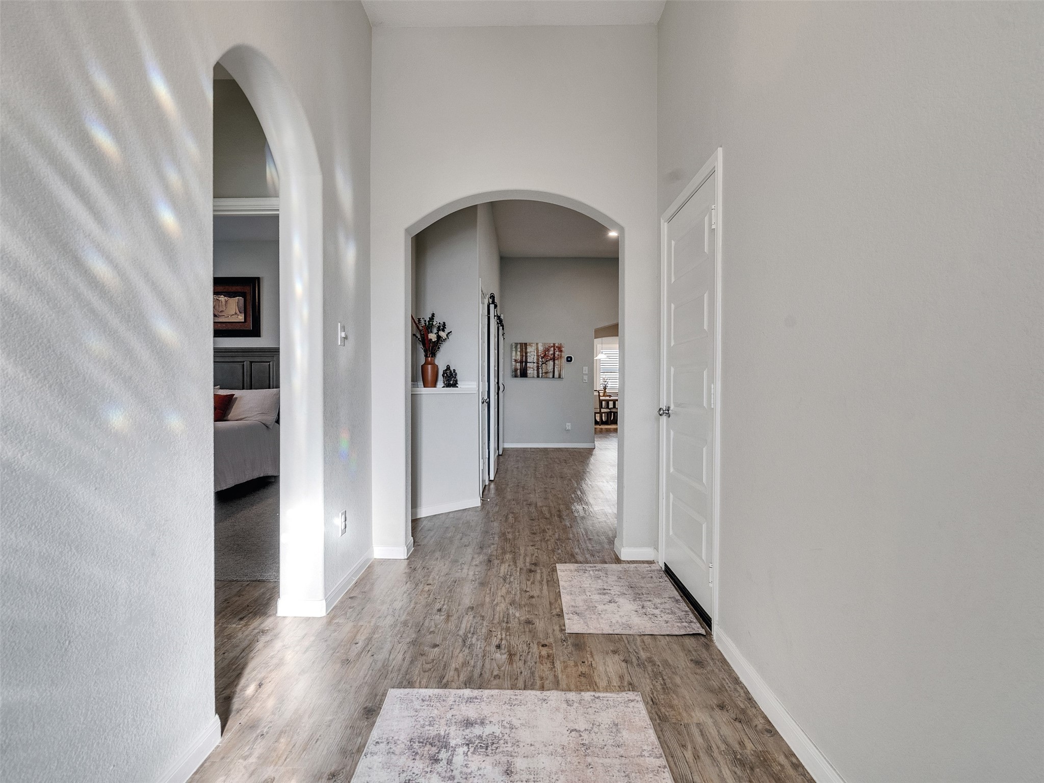 1841 Alyssa Way Alvin, TX 77511 - Photo 8 of 48 a view of a hallway with wooden floor and a bathroom