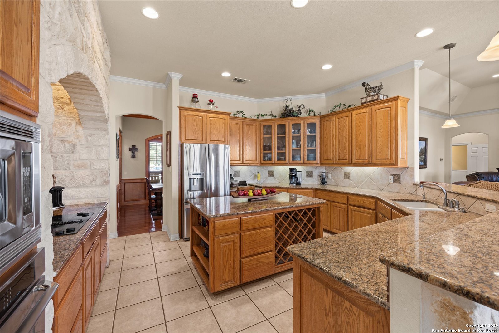 34 Cravey Road Boerne, TX 78006 - Photo 15 of 57 a kitchen with stainless steel appliances granite countertop a sink and a stove