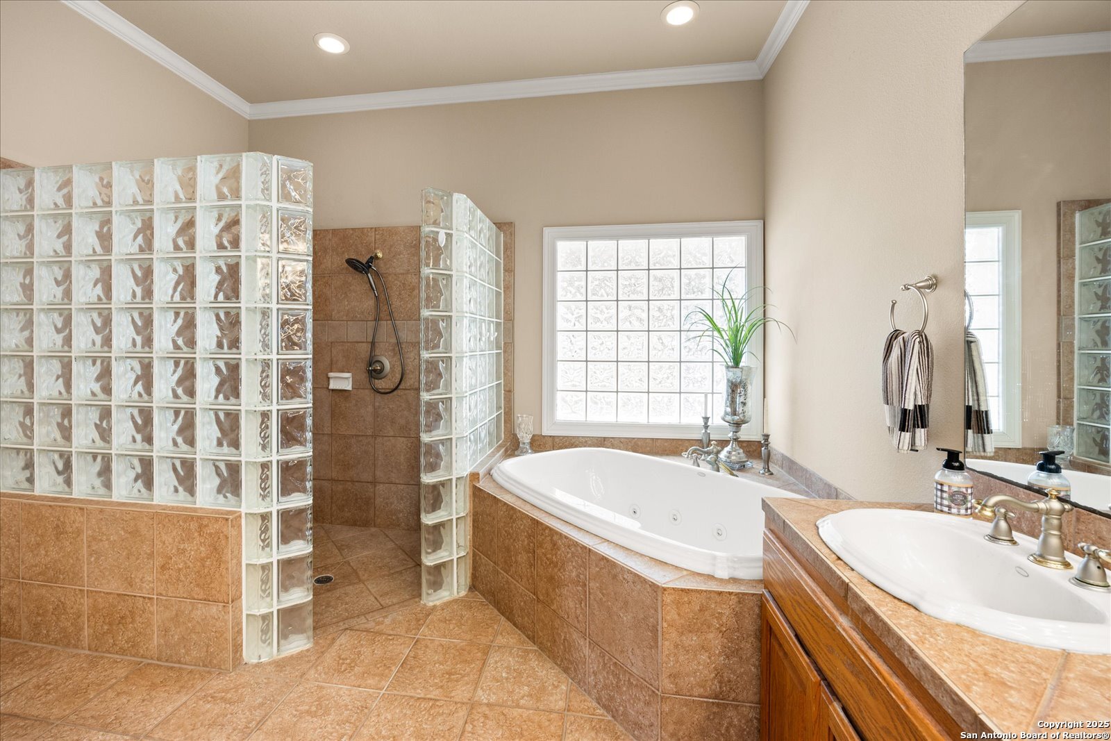 34 Cravey Road Boerne, TX 78006 - Photo 26 of 57 a bathroom with a granite countertop bathtub sink and mirror