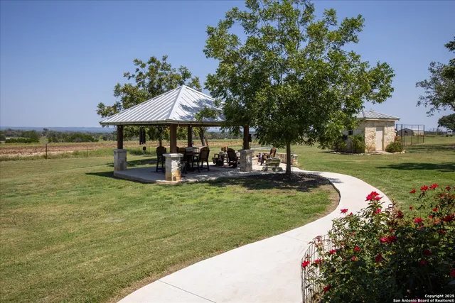 a view of a house with snow on the road
