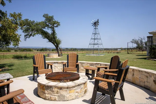 a view of a field with trees in the background